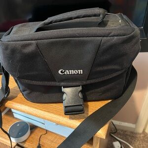 Black canon small camera bag